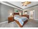 Spacious bedroom with wood furniture and carpet flooring at 3959 San Rocco Ct # 911, Punta Gorda, FL 33950