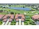 Aerial view of a luxurious condo community with golf course and lake views at 3959 San Rocco Ct # 911, Punta Gorda, FL 33950