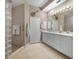 Elegant bathroom with double vanity and glass shower at 3959 San Rocco Ct # 911, Punta Gorda, FL 33950