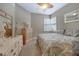 Comfortable bedroom with wood furniture and window shutters at 3959 San Rocco Ct # 911, Punta Gorda, FL 33950