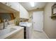 Convenient laundry room with washer, dryer, and utility sink at 3959 San Rocco Ct # 911, Punta Gorda, FL 33950