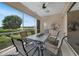 Relaxing screened lanai with outdoor dining set and golf course view at 3959 San Rocco Ct # 911, Punta Gorda, FL 33950
