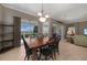 Bright dining area with wooden table and access to a screened lanai at 3959 San Rocco Ct # 911, Punta Gorda, FL 33950
