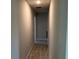 Clean hallway with tile flooring and neutral wall paint at 10133 Audrey St, Port Charlotte, FL 33981