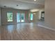 Spacious living room with tile flooring and access to the backyard at 10133 Audrey St, Port Charlotte, FL 33981