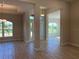 Open concept living area with tile floors and lots of natural light at 10133 Audrey St, Port Charlotte, FL 33981