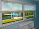 Bedroom with large window showcasing a water view and boat at 729 Macedonia Dr, Punta Gorda, FL 33950