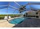Relaxing pool area with screened enclosure and canal view at 729 Macedonia Dr, Punta Gorda, FL 33950