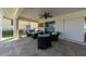 Covered lanai with seating area and fire pit at 729 Macedonia Dr, Punta Gorda, FL 33950