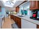 Modern kitchen with wood cabinets, stainless steel appliances, and skylight at 729 Macedonia Dr, Punta Gorda, FL 33950