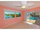 Bright bedroom with pool view and sliding glass doors at 729 Macedonia Dr, Punta Gorda, FL 33950