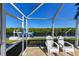 Enjoy the peaceful water view from this screened patio area at 729 Macedonia Dr, Punta Gorda, FL 33950