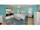 Main bedroom with king-size bed, water view, and coastal decor at 729 Macedonia Dr, Punta Gorda, FL 33950