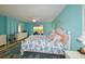 King-size bed, water view, and coastal decor in the main bedroom at 729 Macedonia Dr, Punta Gorda, FL 33950