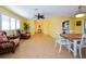 Bright dining room with table and chairs, view into kitchen and living areas at 729 Macedonia Dr, Punta Gorda, FL 33950