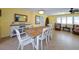 Bright dining room features a wooden table with white chairs at 729 Macedonia Dr, Punta Gorda, FL 33950