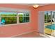 Bright bedroom with pool view and sliding glass doors at 729 Macedonia Dr, Punta Gorda, FL 33950