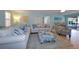 Bright living room with comfy seating, large TV, and coastal decor at 729 Macedonia Dr, Punta Gorda, FL 33950
