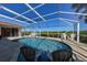 Relaxing pool and patio area with screened enclosure at 729 Macedonia Dr, Punta Gorda, FL 33950