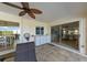 Covered lanai with outdoor kitchen and dining area view at 729 Macedonia Dr, Punta Gorda, FL 33950