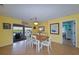 Dining area with wooden table, chairs, and access to patio at 729 Macedonia Dr, Punta Gorda, FL 33950