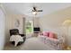Relaxing bedroom with a comfy couch and large window at 1355 Hempstead Ave, North Port, FL 34286