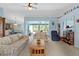 Living room with view of pool and lanai at 1355 Hempstead Ave, North Port, FL 34286