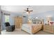 Spacious main bedroom with a king-size bed and an ensuite bathroom at 1355 Hempstead Ave, North Port, FL 34286