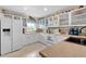 Well-equipped kitchen featuring white cabinets and granite countertops at 1355 Hempstead Ave, North Port, FL 34286