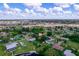 Aerial view of the property, highlighting its location near a canal at 109 Barre Nw Dr, Port Charlotte, FL 33952