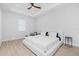 Spacious bedroom with a king-size bed and ceiling fan at 2743 Hopwood Rd, North Port, FL 34287