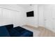 Gathering room with a blue sofa and built in closet at 2743 Hopwood Rd, North Port, FL 34287
