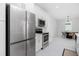Modern kitchen with stainless steel appliances and white cabinetry at 2743 Hopwood Rd, North Port, FL 34287