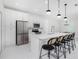 Modern kitchen with stainless steel appliances and white cabinetry at 2743 Hopwood Rd, North Port, FL 34287