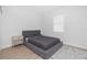 Comfortable bedroom with a gray platform bed and wood floors at 2743 Hopwood Rd, North Port, FL 34287