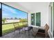 Relaxing screened patio with seating area, perfect for outdoor enjoyment at 2743 Hopwood Rd, North Port, FL 34287