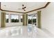Bright bedroom with pool view, and large windows at 5000 Palermo Dr, Punta Gorda, FL 33950