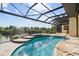 Inviting pool with a covered lanai and scenic water views at 5000 Palermo Dr, Punta Gorda, FL 33950