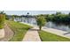 Landscaped waterfront walkway leading to private dock at 5000 Palermo Dr, Punta Gorda, FL 33950