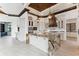 Gourmet kitchen with large island, custom cabinetry, and high-end appliances at 5000 Palermo Dr, Punta Gorda, FL 33950