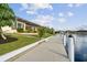 Waterfront property with a walkway and lush landscaping at 5000 Palermo Dr, Punta Gorda, FL 33950