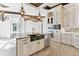 Gourmet kitchen with custom cabinetry and a large island at 5000 Palermo Dr, Punta Gorda, FL 33950