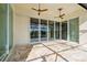 Covered lanai with sliding glass doors offering access to the pool area at 5000 Palermo Dr, Punta Gorda, FL 33950