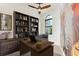 Home office with built-in shelves, large elephant mural, and wood desk at 5000 Palermo Dr, Punta Gorda, FL 33950