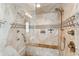 Spacious walk-in shower with glass enclosure and designer tile at 5000 Palermo Dr, Punta Gorda, FL 33950