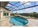 Resort-style pool with covered patio and water view at 5000 Palermo Dr, Punta Gorda, FL 33950