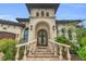 Elegant home exterior with ornate double doors and stone steps at 5000 Palermo Dr, Punta Gorda, FL 33950