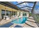 Luxury pool with patio furniture and canal view at 5000 Palermo Dr, Punta Gorda, FL 33950