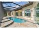 Inviting pool area with covered patio, providing shade and relaxation at 5000 Palermo Dr, Punta Gorda, FL 33950