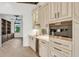 Custom wet bar with wine cooler and high-end appliances at 5000 Palermo Dr, Punta Gorda, FL 33950